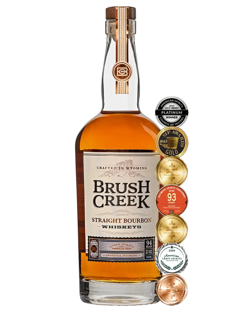 Bottle of Brush Creek Straight Bourbon Whiskey with awards listed to right of bottle