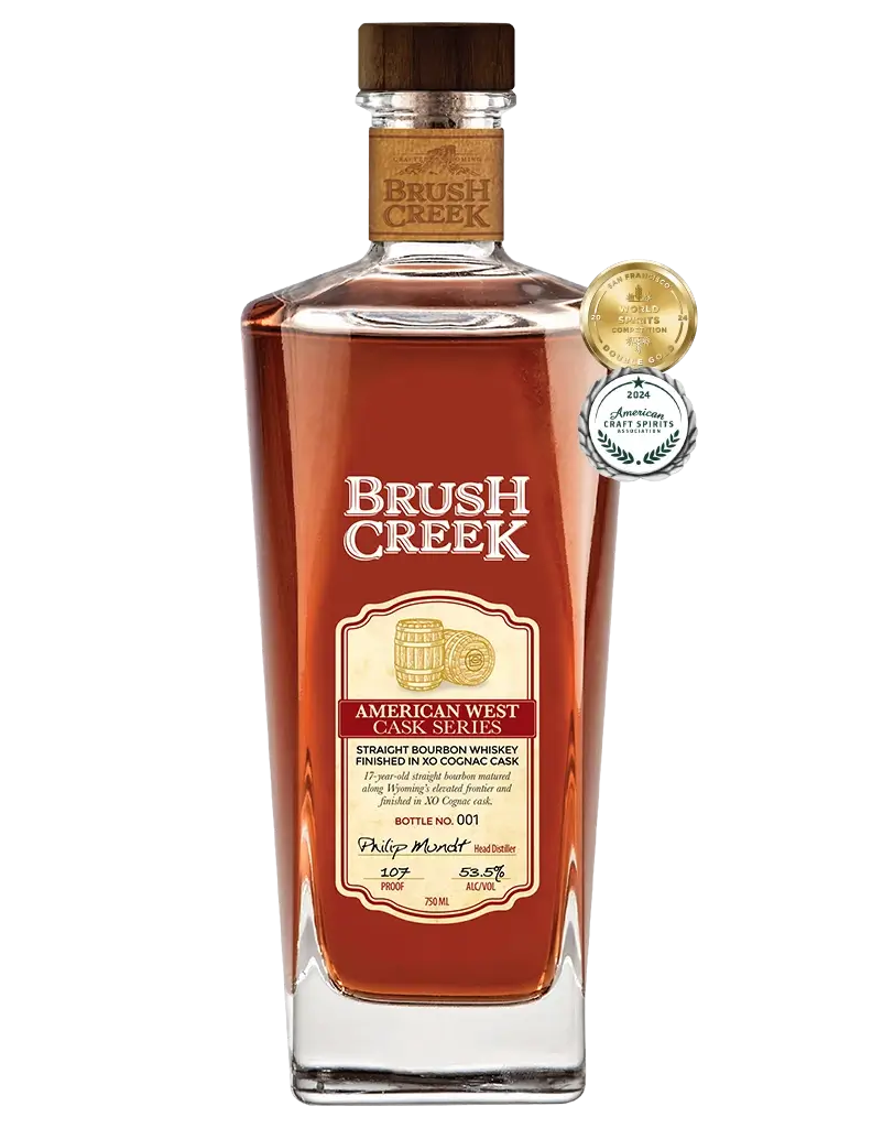 Bottle of Brush Creek American West Cask Series Straight Bourbon Whiskey - Finished in XO Cognac Cask with awards listed to the right of the bottle